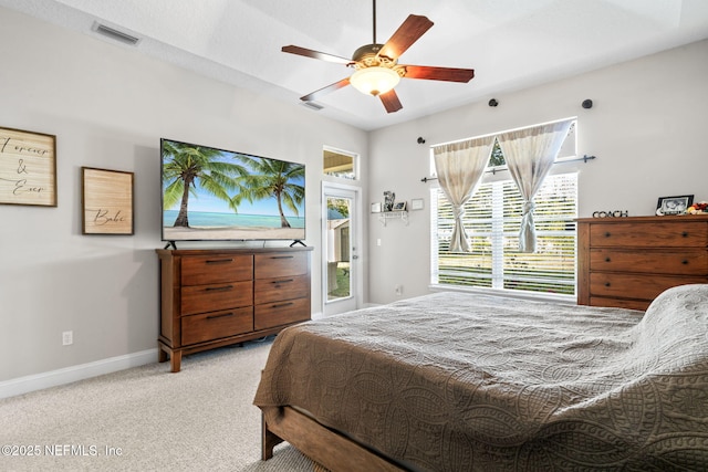 bedroom featuring light carpet, visible vents, baseboards, ceiling fan, and access to outside