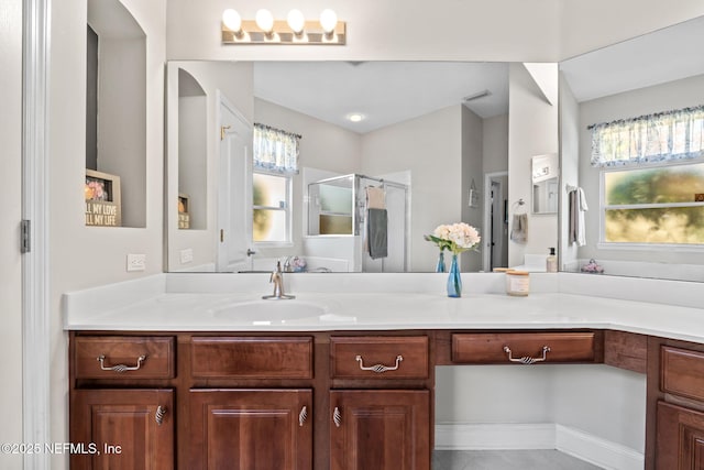 bathroom featuring a shower stall, visible vents, a wealth of natural light, and vanity