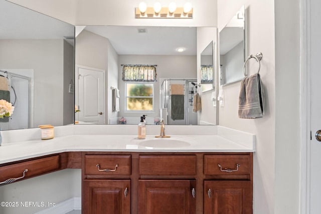 full bathroom featuring a stall shower and vanity