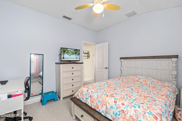 carpeted bedroom featuring a ceiling fan, lofted ceiling, visible vents, and a textured ceiling