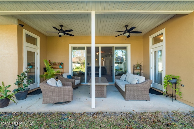 view of patio featuring a ceiling fan and an outdoor living space