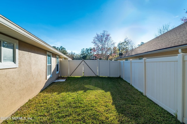 view of yard with a fenced backyard