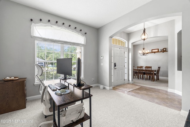 3077 Five Oaks Ln, Green Cove Springs, FL 32043 - office featuring arched walkways, a chandelier, carpet floors, and baseboards