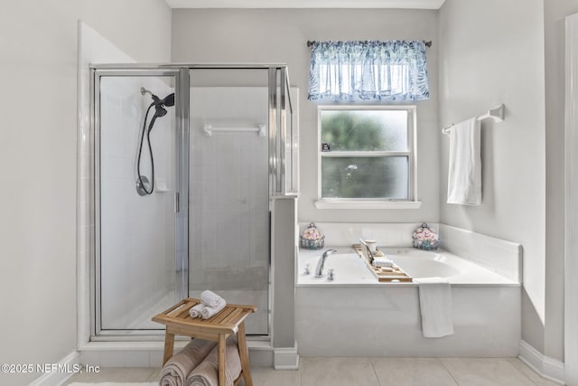 3077 Five Oaks Ln, Green Cove Springs, FL 32043 - bathroom with a stall shower, a bath, baseboards, and tile patterned flooring