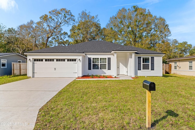 single story home with driveway, an attached garage, fence, and a front yard