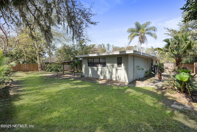 exterior space with cooling unit and fence