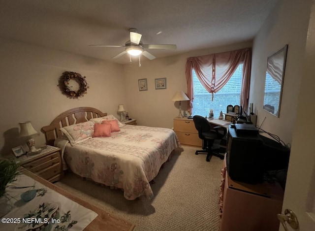 bedroom with light carpet and ceiling fan