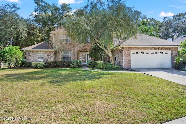 view of front of home with a garage, a front yard, concrete driveway, and brick siding