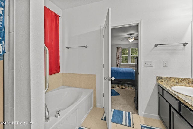 full bathroom featuring ceiling fan, vanity, ensuite bath, a bath, and tile patterned floors