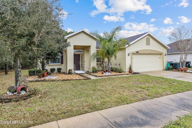 ranch-style home with a garage, driveway, a front lawn, and stucco siding