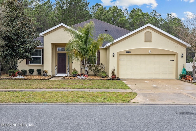 ranch-style home featuring roof with shingles, stucco siding, concrete driveway, a garage, and a front lawn