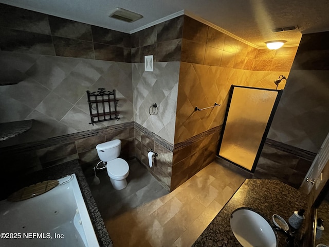 full bathroom featuring toilet, a bathing tub, and tile walls