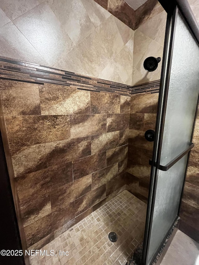 full bathroom featuring a stall shower