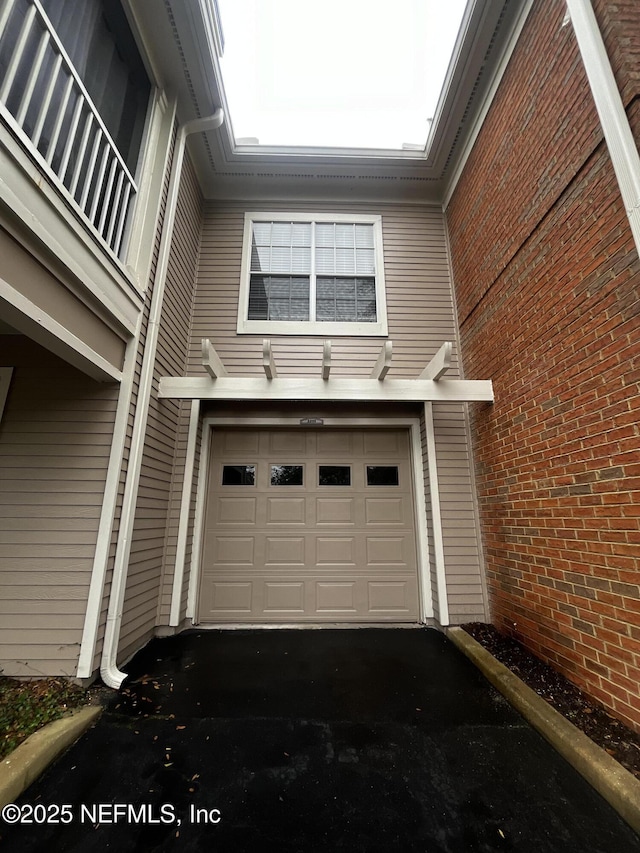 garage with driveway