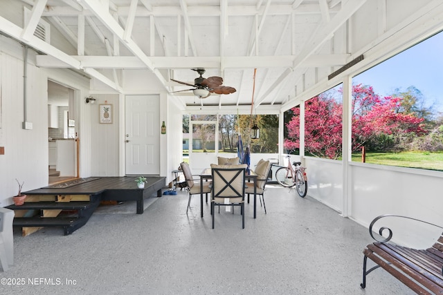 sunroom featuring a ceiling fan