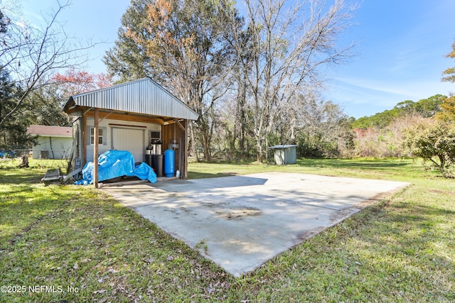 exterior space featuring an outbuilding and a shed