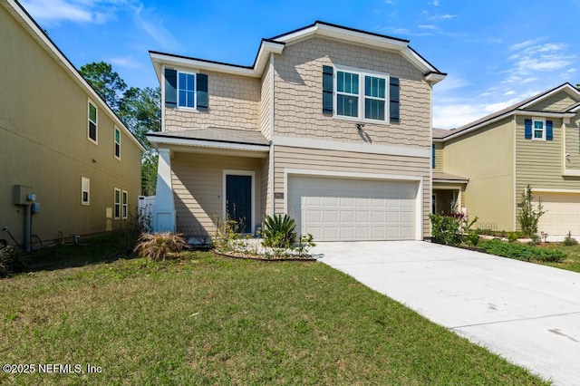 view of front of home featuring driveway, a front lawn, and an attached garage