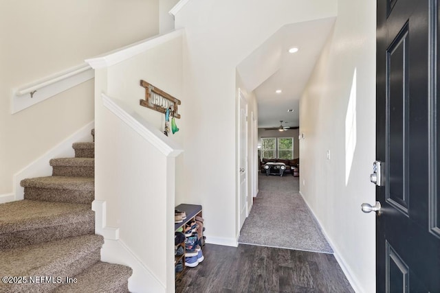 foyer entrance with baseboards, a ceiling fan, dark wood-style flooring, stairs, and recessed lighting