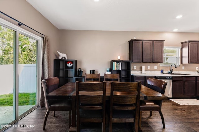 dining space with dark wood-type flooring and recessed lighting