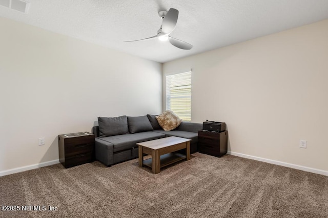 living area featuring carpet, visible vents, ceiling fan, and baseboards