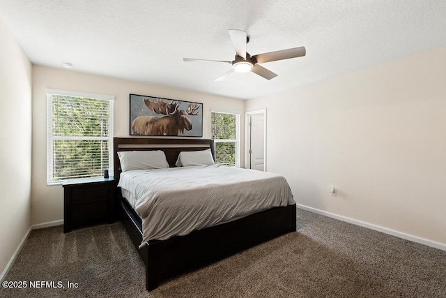 carpeted bedroom featuring baseboards and a ceiling fan