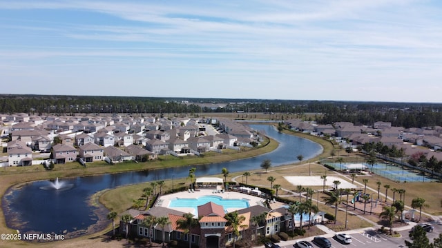 drone / aerial view featuring a water view and a residential view