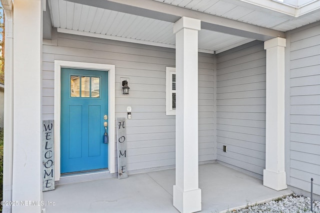 property entrance featuring covered porch