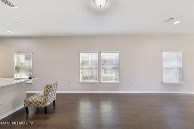 office area with baseboards, visible vents, dark wood finished floors, and recessed lighting