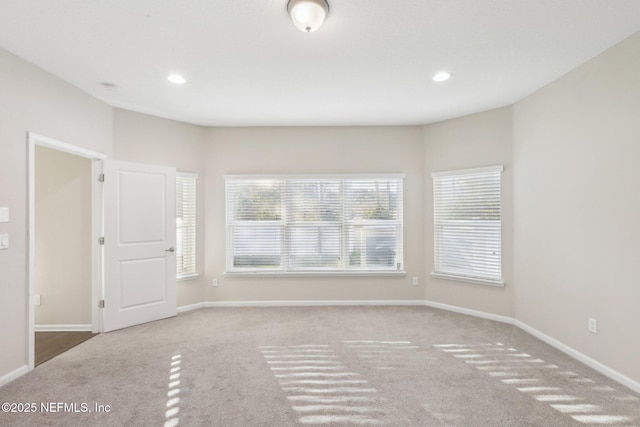 carpeted spare room with recessed lighting and baseboards