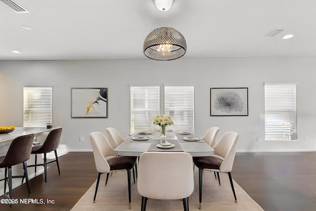 dining space featuring dark wood-style floors, recessed lighting, visible vents, and plenty of natural light