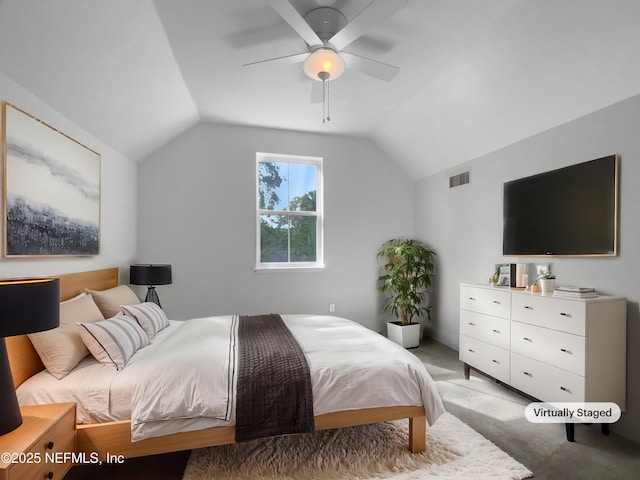 bedroom with light carpet, lofted ceiling, visible vents, and a ceiling fan