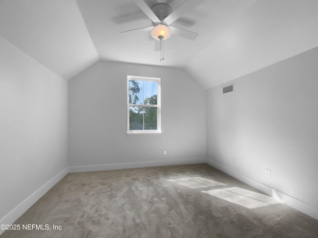 bonus room with carpet, visible vents, vaulted ceiling, and ceiling fan