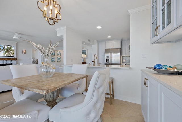 dining room with baseboards, light tile patterned flooring, a ceiling fan, and recessed lighting