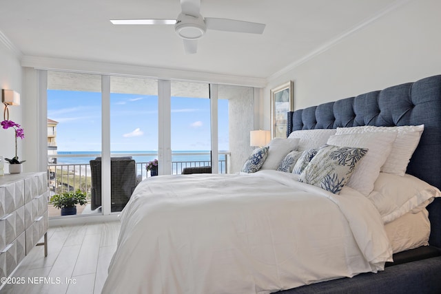 bedroom featuring ceiling fan, ornamental molding, a water view, and floor to ceiling windows