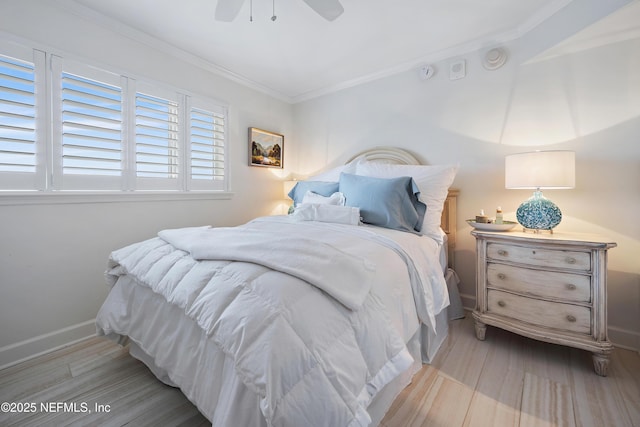 bedroom featuring baseboards, ornamental molding, ceiling fan, and wood finished floors