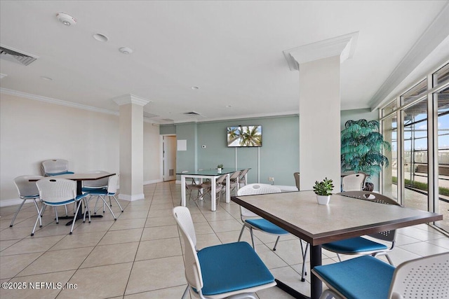 dining room with light tile patterned floors, ornamental molding, visible vents, and decorative columns