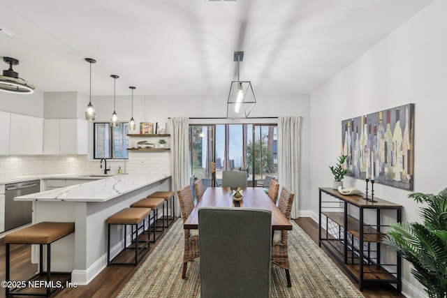 dining room featuring visible vents, baseboards, and dark wood-type flooring