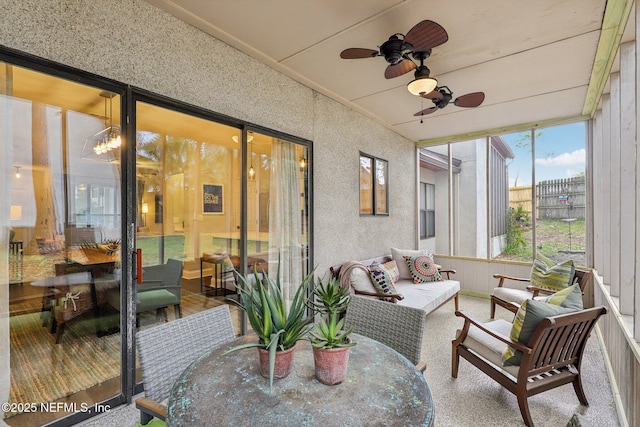 sunroom featuring ceiling fan