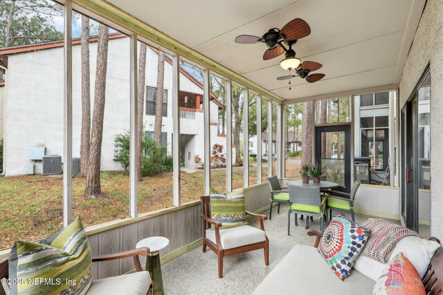 sunroom / solarium with ceiling fan