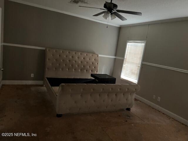 living area featuring a ceiling fan, crown molding, and baseboards