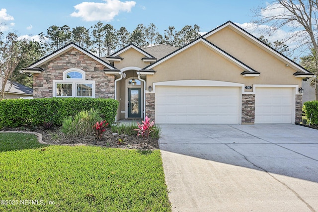 view of front of home featuring stucco siding, stone siding, concrete driveway, a front yard, and an attached garage