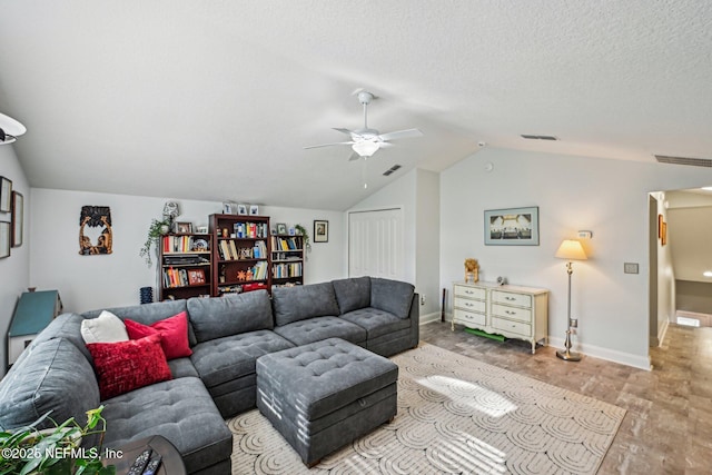 living area featuring light wood-type flooring, visible vents, a ceiling fan, a textured ceiling, and vaulted ceiling