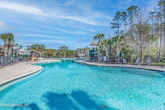 pool featuring a patio and fence