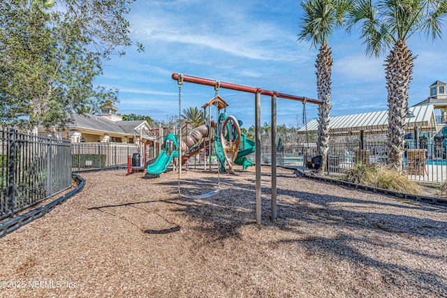 communal playground featuring fence