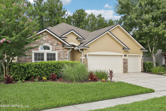 741 W Kings College Dr, Saint Johns, FL 32259 - view of front of house featuring stone siding, stucco siding, a garage, and concrete driveway