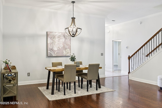 741 W Kings College Dr, Saint Johns, FL 32259 - dining area featuring a chandelier, dark wood-style floors, stairs, and ornamental molding