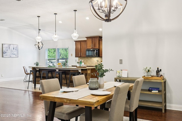741 W Kings College Dr, Saint Johns, FL 32259 - dining room with crown molding, a chandelier, dark wood finished floors, vaulted ceiling, and recessed lighting