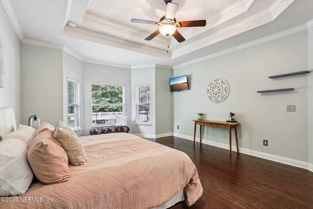 741 W Kings College Dr, Saint Johns, FL 32259 - bedroom featuring a tray ceiling, wood finished floors, crown molding, and ceiling fan