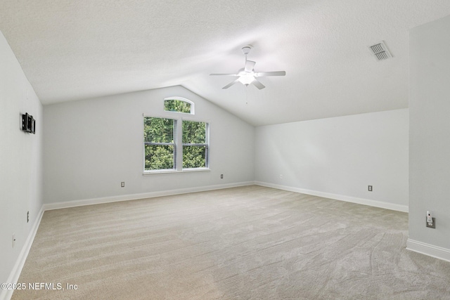 741 W Kings College Dr, Saint Johns, FL 32259 - bonus room with light carpet, ceiling fan, vaulted ceiling, and a textured ceiling