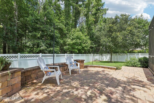 741 W Kings College Dr, Saint Johns, FL 32259 - fenced backyard featuring a patio